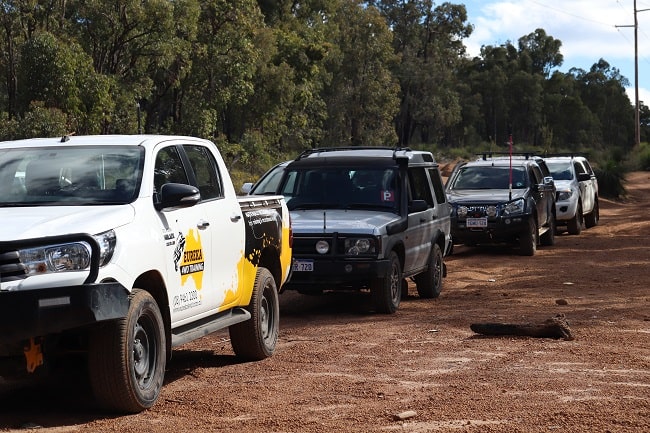 Convoy 4wders travelling on an off-road track.