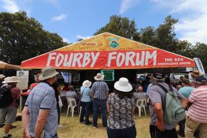 People gathering at a tent namely "Fourby Forum" at the 4WD adventure show and recap.