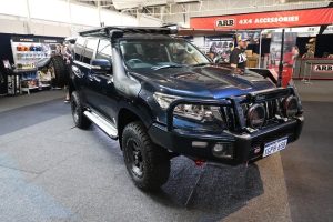 Black-coloured 4WD parked as a participant of the 2019 caravan/camping show in Perth.